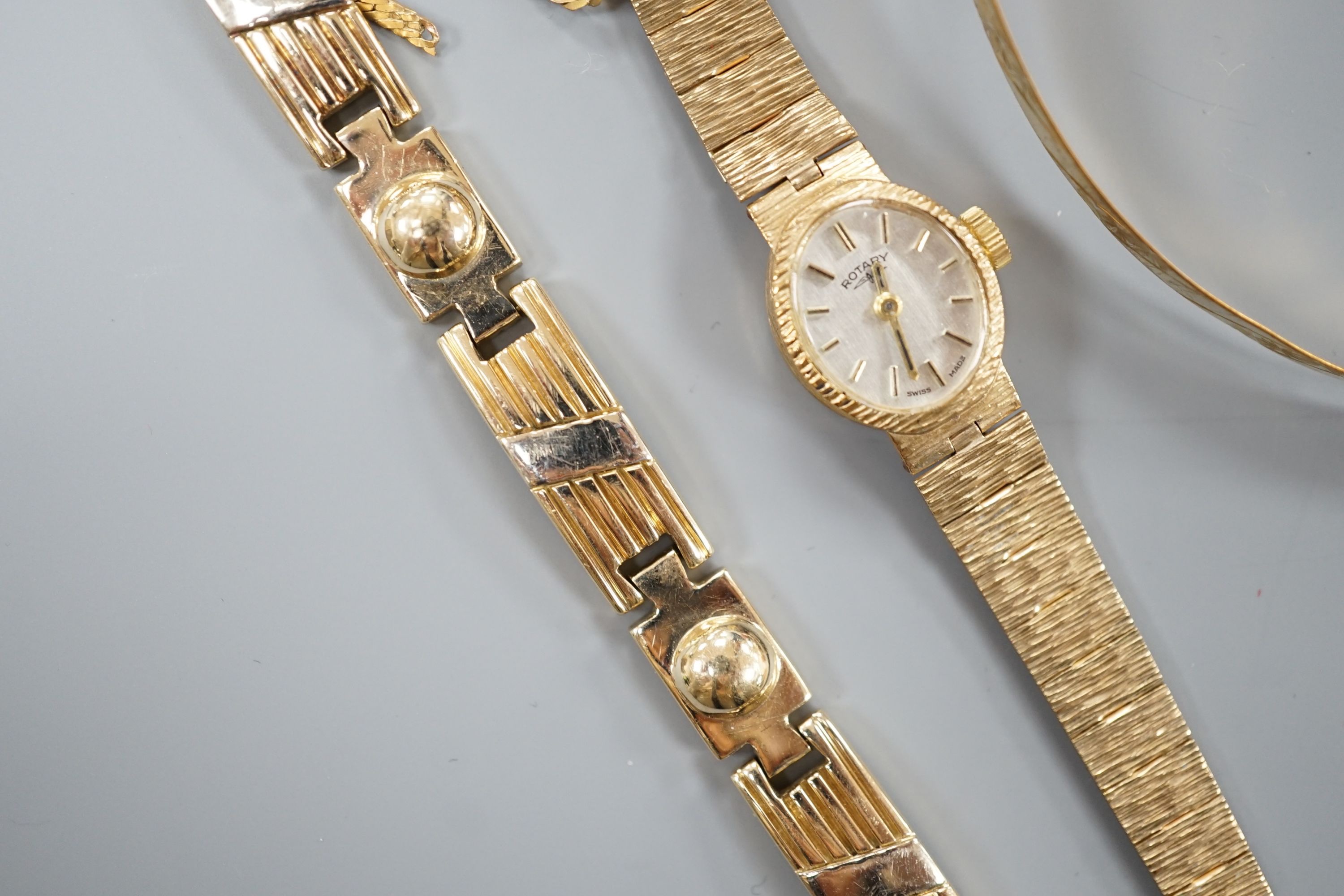 A lady's 9ct gold Rotary manual wind wrist watch on 9ct bracelet, gross 15.4 grams, five damaged 9ct gold items, 15 grams and a 585 yellow metal bracelet, 29.5 grams.